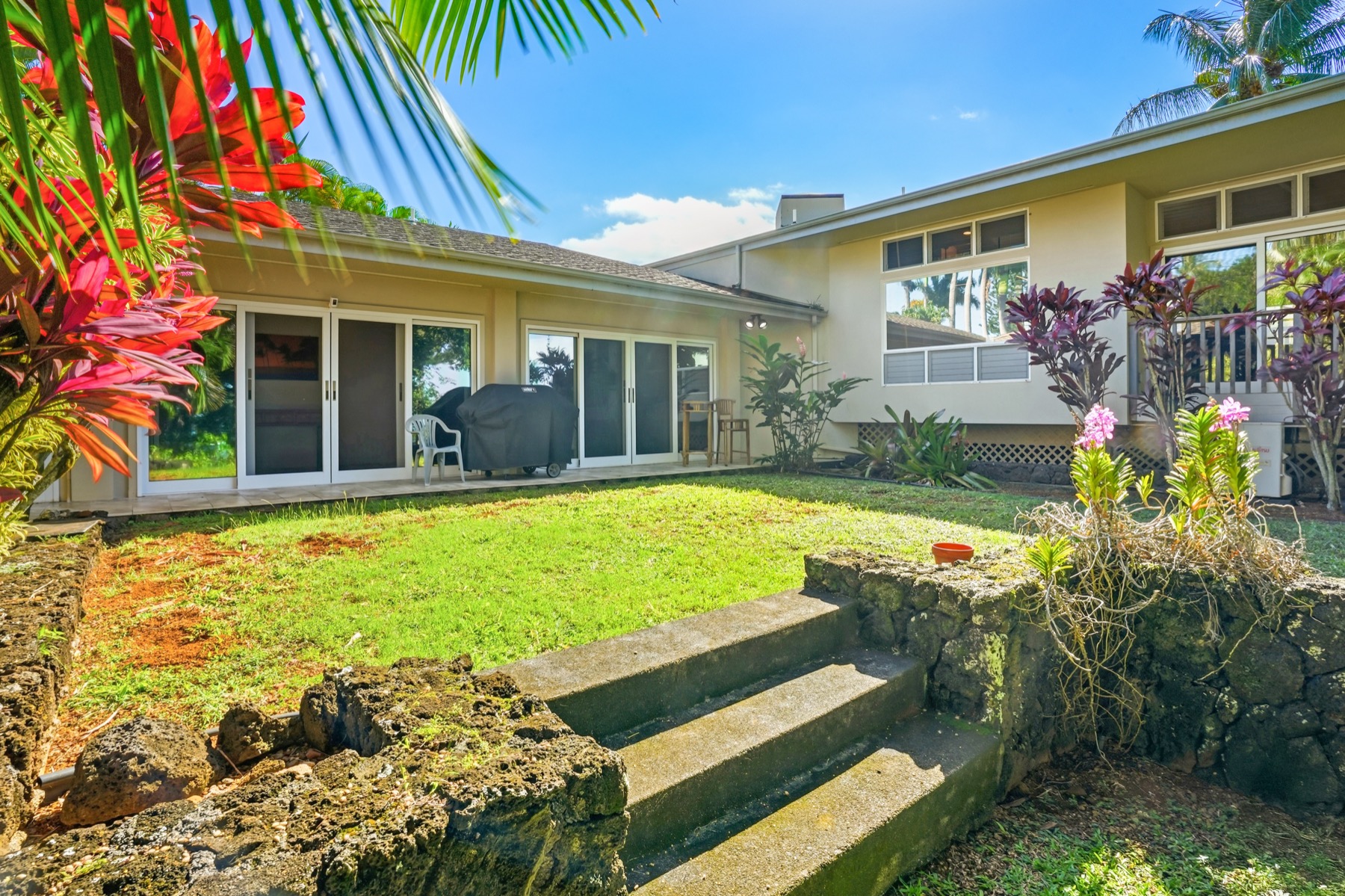 3564 Kaweonui Road Princeville, HI 96722 - Photo 27 of 30 a view of a house with backyard and sitting area