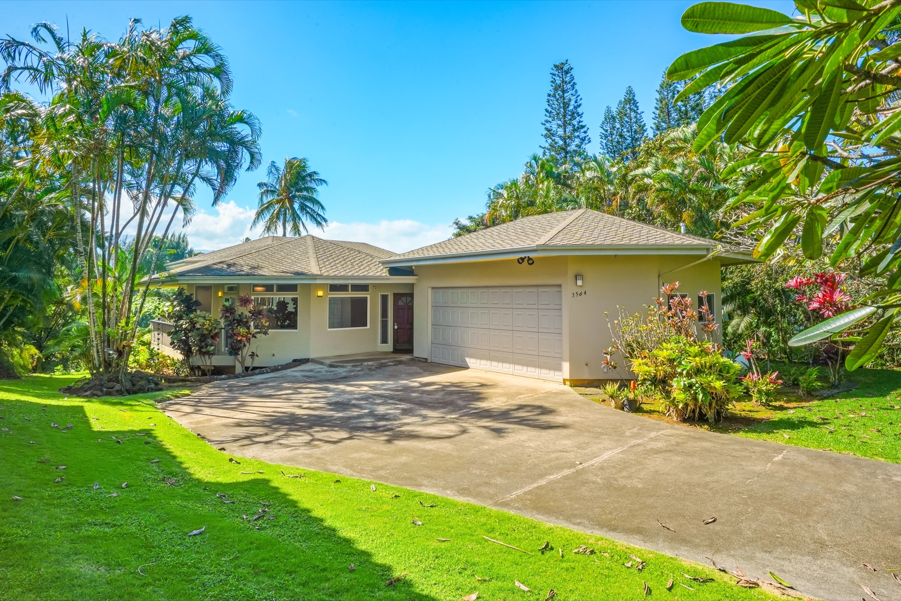3564 Kaweonui Road Princeville, HI 96722 - Photo 29 of 30 a front view of a house with garden