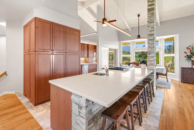 a dining table with chairs and wooden floor