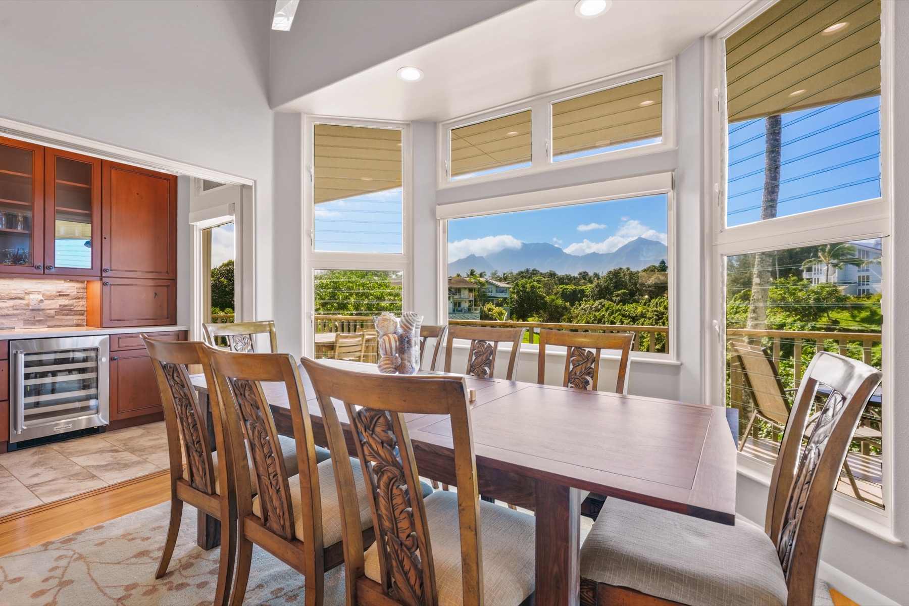 3564 Kaweonui Road Princeville, HI 96722 - Photo 6 of 30 a view of a dining room with furniture large windows and wooden floor