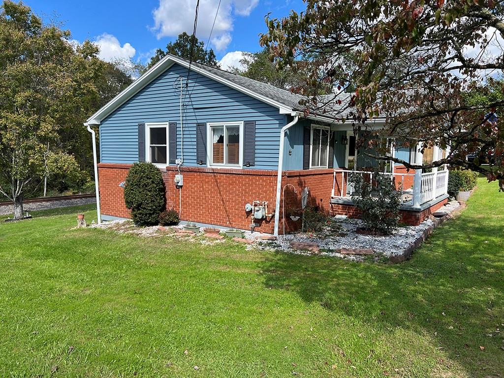 76 Cherry Run Road Homer City, PA 15748 - Photo 5 of 20 a view of a house with a yard patio and fire pit
