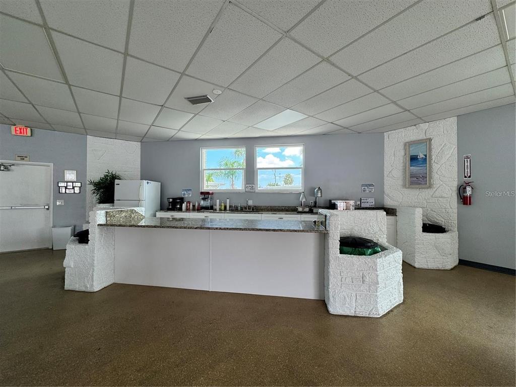 250 Rosery Road Northwest, Unit 283 Largo, FL 33770 - Photo 22 of 23 a kitchen with a sink and cabinets