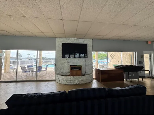 a living room with fireplace furniture and a flat screen tv