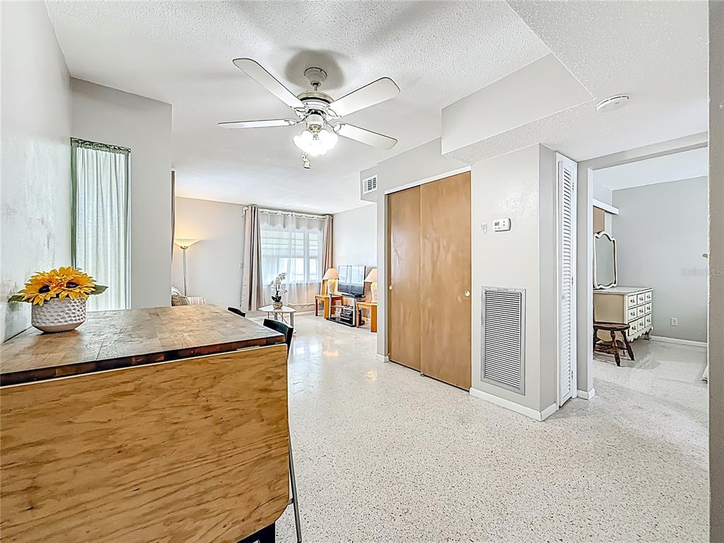 250 Rosery Road Northwest, Unit 283 Largo, FL 33770 - Photo 8 of 23 a dining hall with granite countertop wooden floor and chandelier