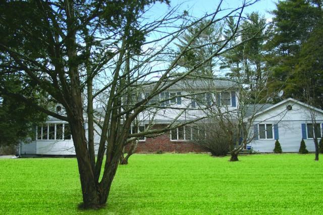 221 Danbury Road Ridgefield, CT 06877 - Photo 1 of 1 a front view of a house with a yard