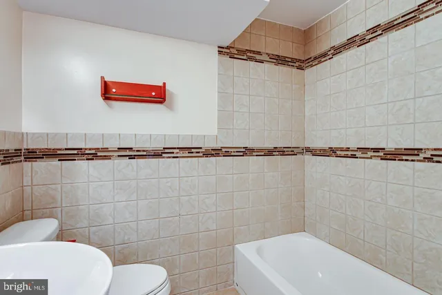 a bathroom with a toilet and a sink