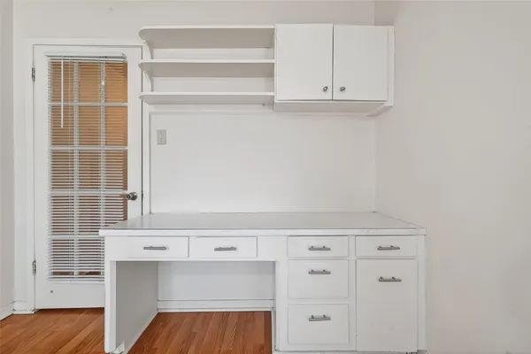 a view of kitchen with furniture and wooden floor