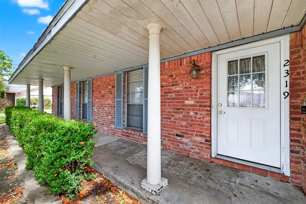 a front view of a house with a porch