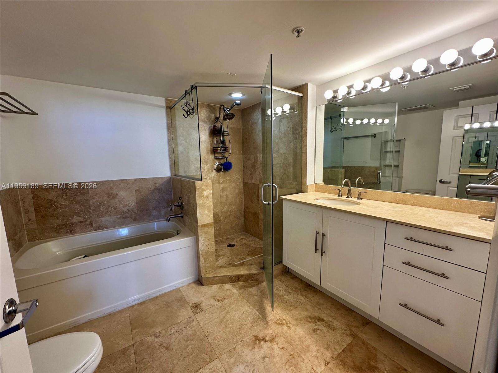 3232 Southwest 22nd Terrace, Unit 1604 Miami, FL 33145 - Photo 16 of 40 a bathroom with a sink a toilet and shower