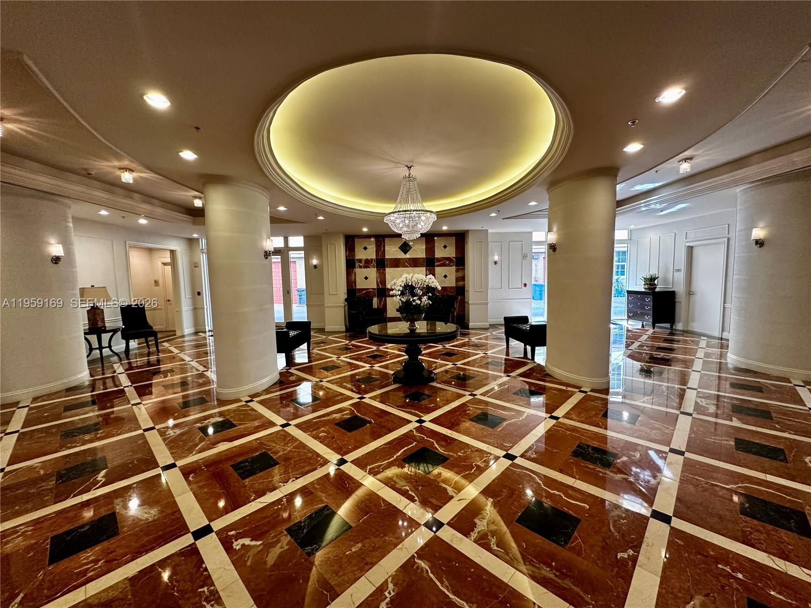 3232 Southwest 22nd Terrace, Unit 1604 Miami, FL 33145 - Photo 2 of 40 a room with gym equipment and a mirror