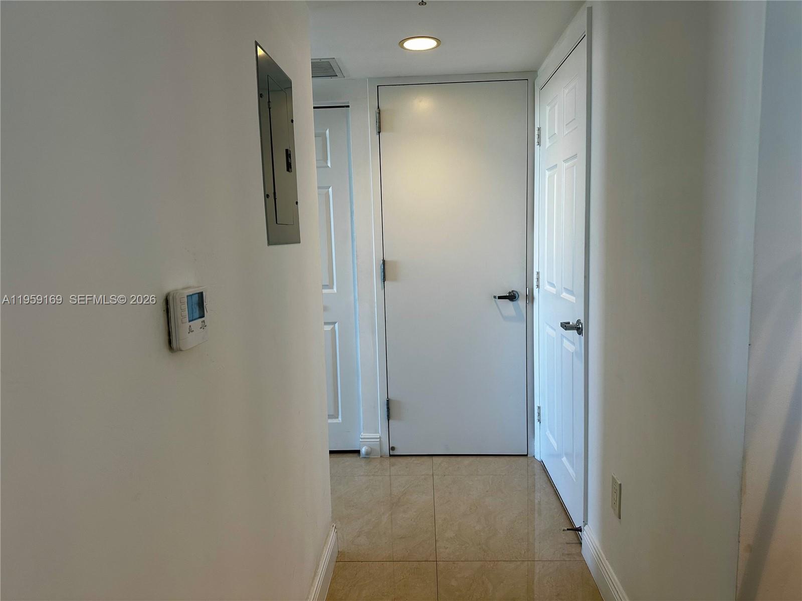 3232 Southwest 22nd Terrace, Unit 1604 Miami, FL 33145 - Photo 22 of 40 a view of a hallway with closet area