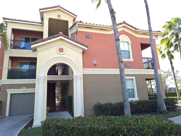 a view of a house with large windows