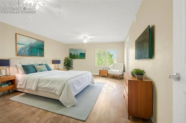 a bedroom with bed couch and window