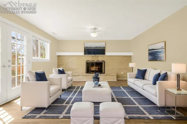 a living room with furniture and a fireplace