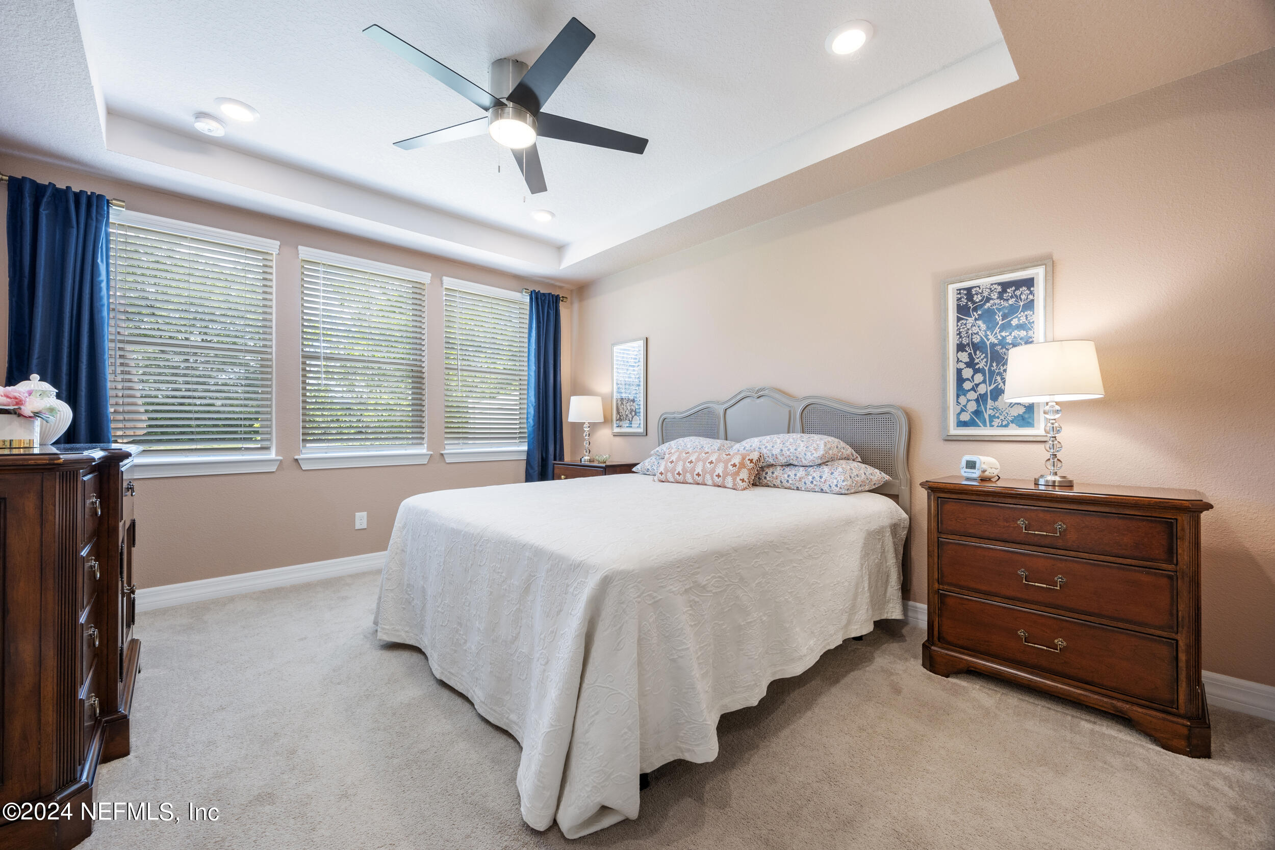 220 Rock Spg Loop St. Augustine, FL 32095 - Photo 13 of 30 a bedroom with a bed and a large window