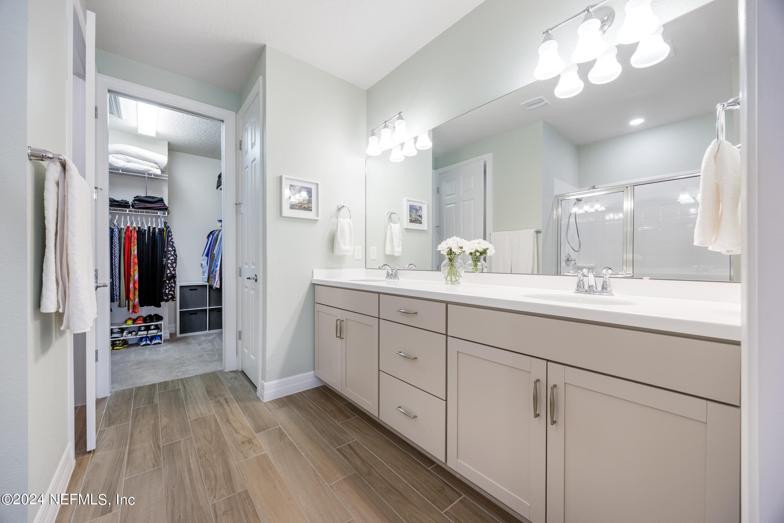 220 Rock Spg Loop St. Augustine, FL 32095 - Photo 15 of 30 a spacious bathroom with a double vanity sink and a mirror