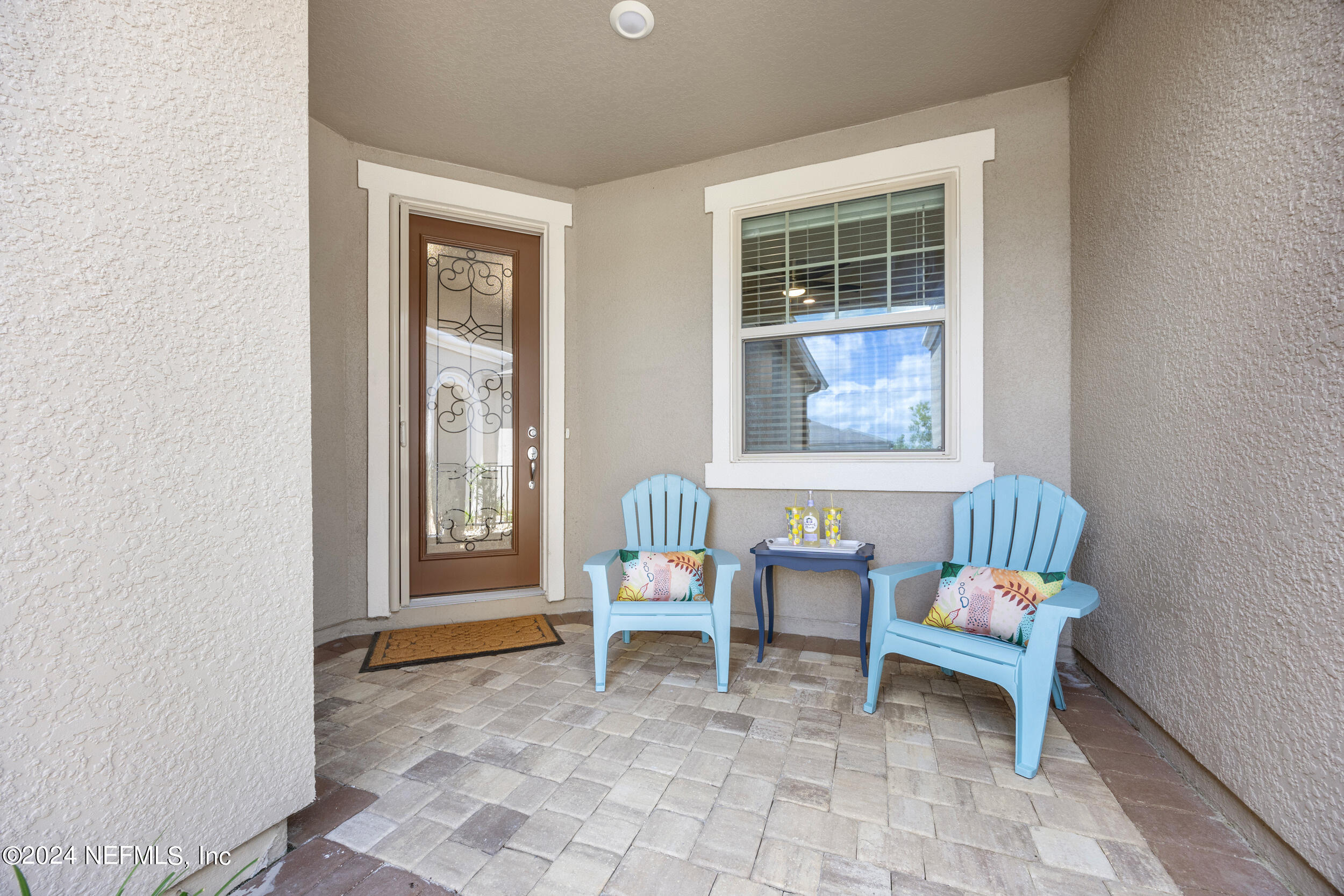 220 Rock Spg Loop St. Augustine, FL 32095 - Photo 2 of 30 a chair and a table in a room
