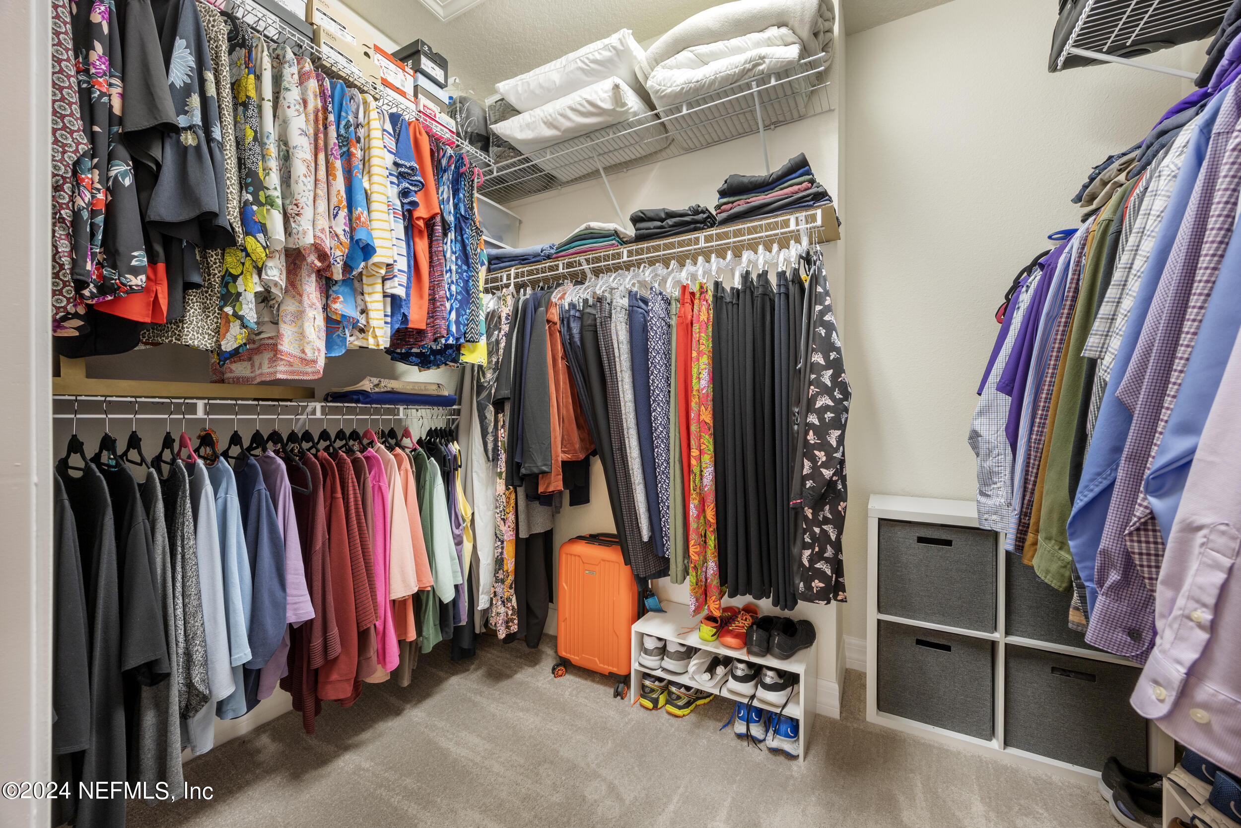 220 Rock Spg Loop St. Augustine, FL 32095 - Photo 17 of 30 a view of walk in closet with clothes