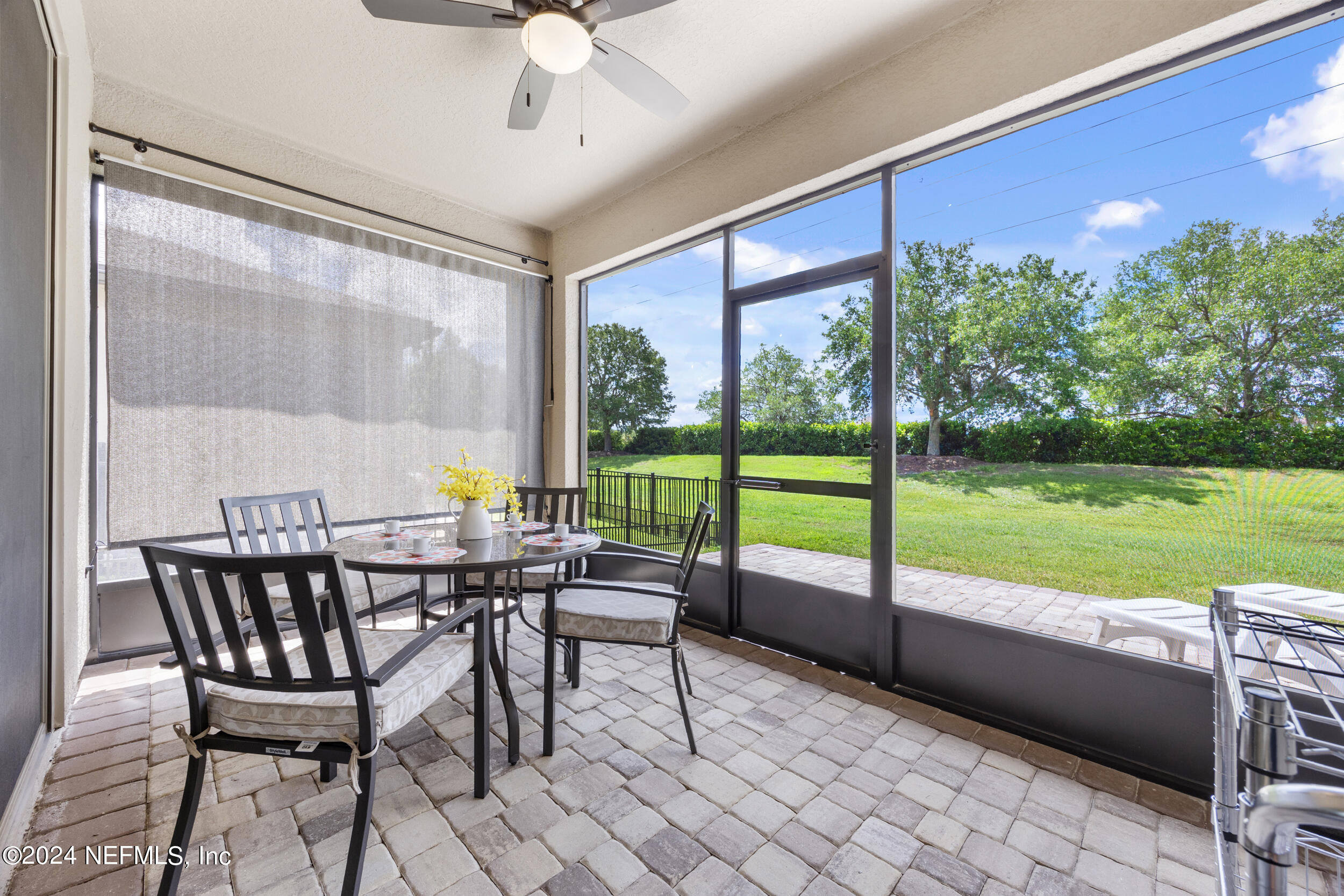 220 Rock Spg Loop St. Augustine, FL 32095 - Photo 23 of 30 a view of a patio with a table chairs and a table
