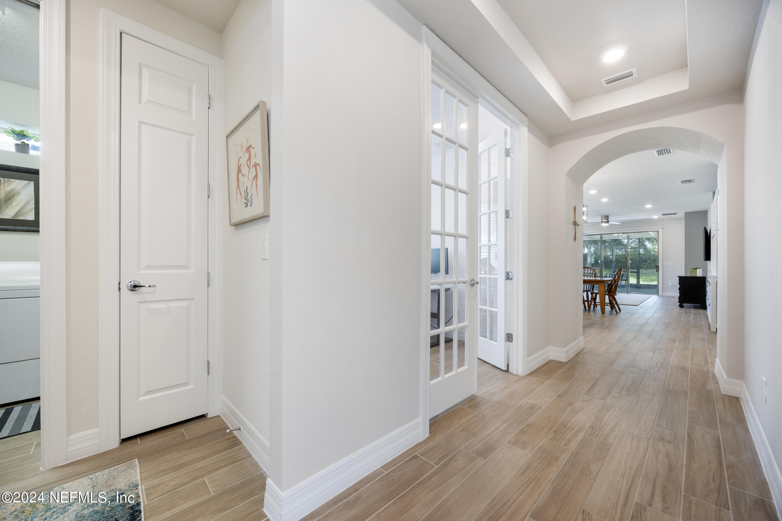 220 Rock Spg Loop St. Augustine, FL 32095 - Photo 3 of 30 a view of a hallway with wooden floor and closet