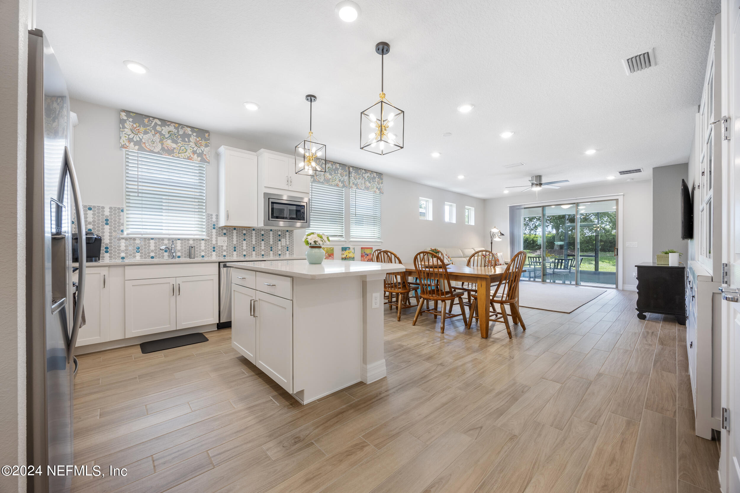 220 Rock Spg Loop St. Augustine, FL 32095 - Photo 6 of 30 a kitchen with a sink appliances and cabinets