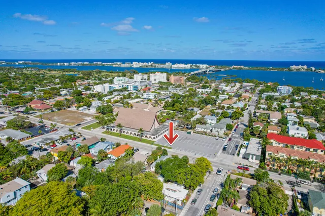 an aerial view of residential building and ocean