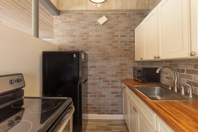 a bathroom with a sink a vanity and a mirror