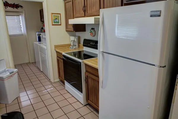 a view of a park with swings and a table