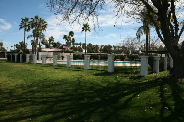 a bedroom with a bed and a chair