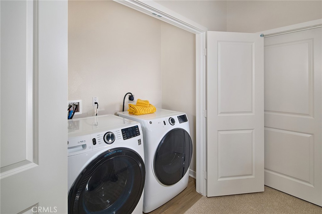 5911 Rockport Road Eastvale, CA 92880 - Photo 14 of 39 a utility room with dryer and washer