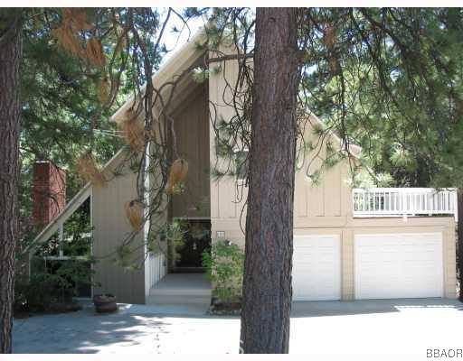 690 Rhine Road Lake Arrowhead, CA 92352 - Photo 1 of 8 a picture of a tree in front of a house
