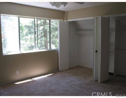 690 Rhine Road Lake Arrowhead, CA 92352 - Photo 5 of 8 an empty room with windows