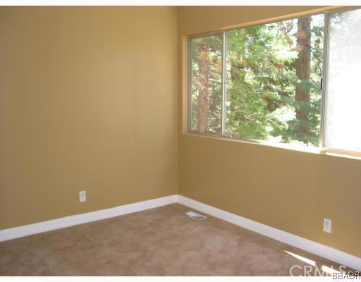 690 Rhine Road Lake Arrowhead, CA 92352 - Photo 8 of 8 a view of an empty room with a window