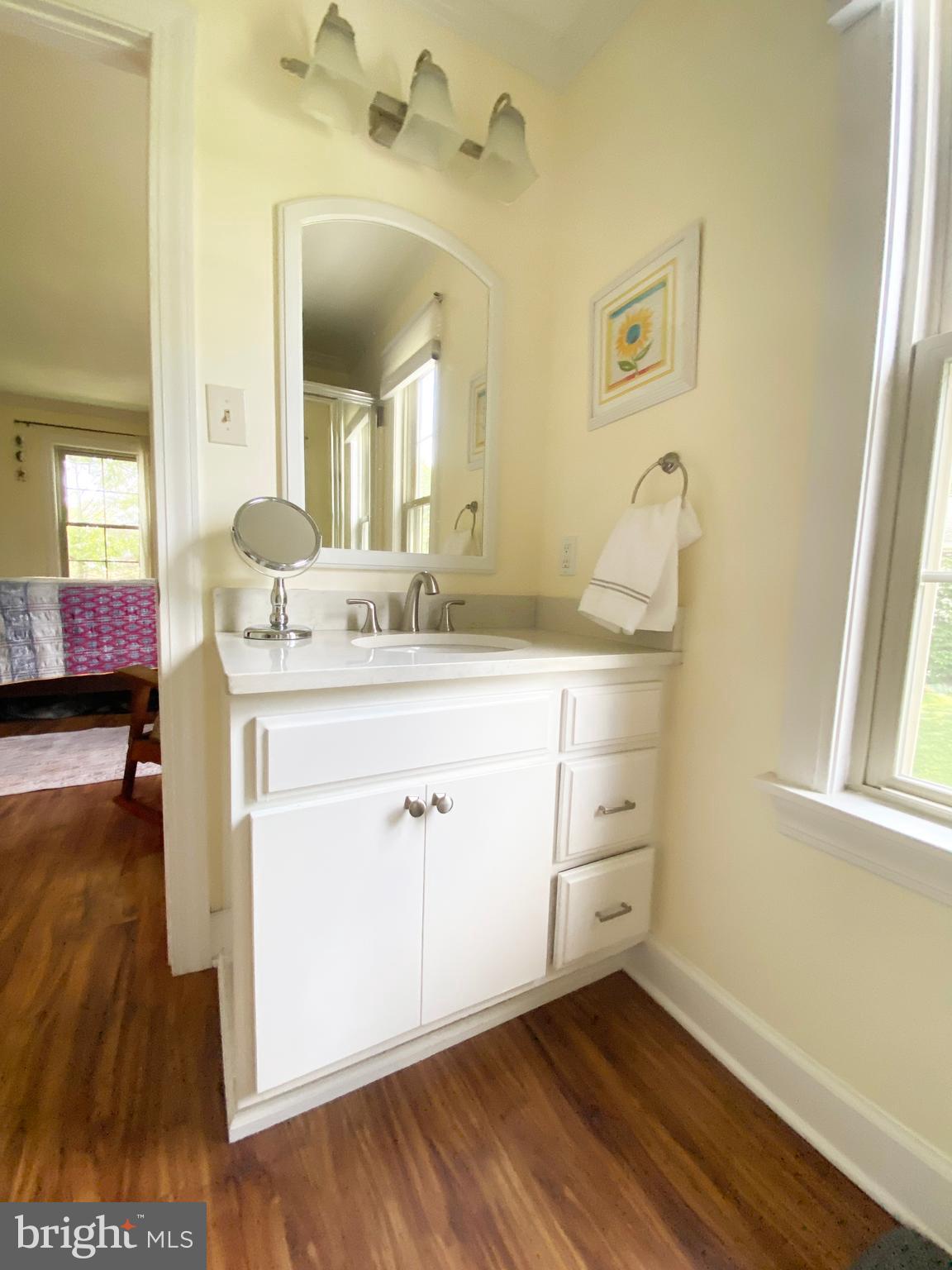 295 Sugartown Road Wayne, PA 19087 - Photo 22 of 36 a spacious bathroom with a sink and a mirror