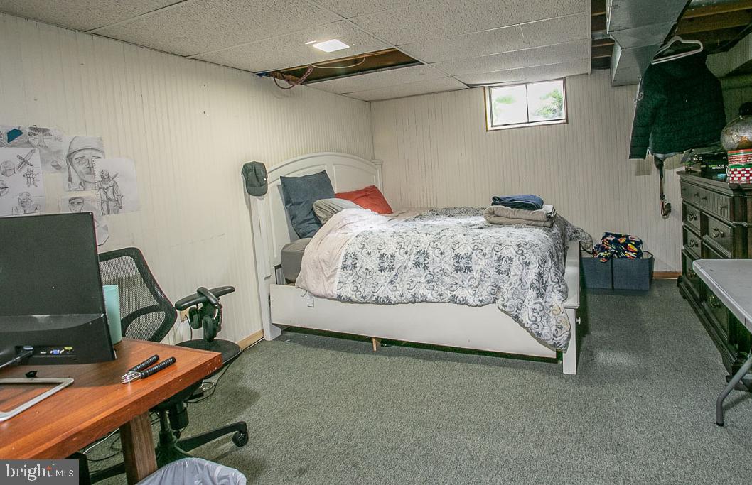 295 Sugartown Road Wayne, PA 19087 - Photo 26 of 36 a bedroom with furniture and a flat screen tv
