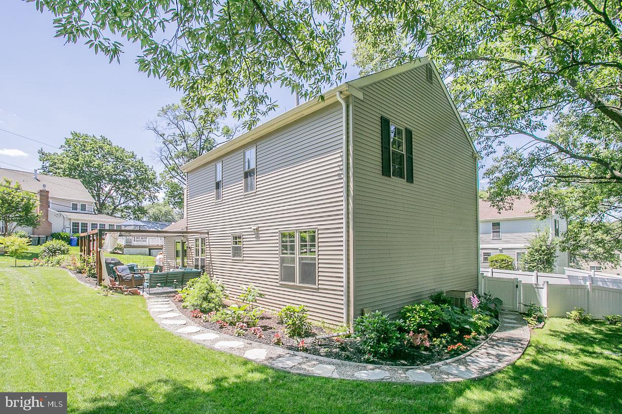 295 Sugartown Road Wayne, PA 19087 - Photo 28 of 36 a view of a house with a yard and plants