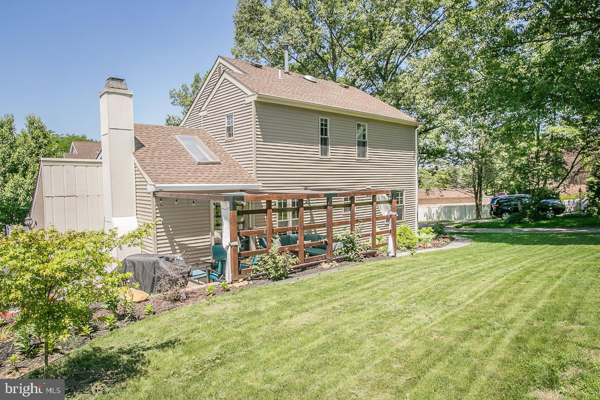 295 Sugartown Road Wayne, PA 19087 - Photo 33 of 36 a view of a house with yard and sitting area