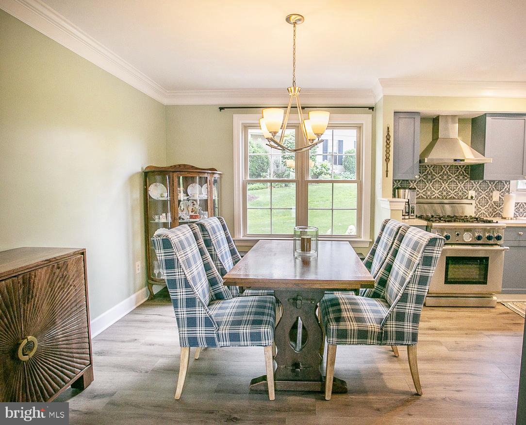 295 Sugartown Road Wayne, PA 19087 - Photo 9 of 36 a view of a dining room with furniture window and wooden floor