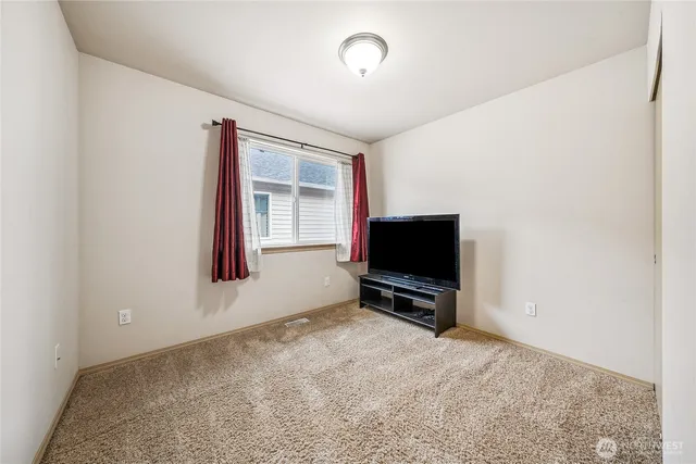 a room with furniture and a flat screen tv