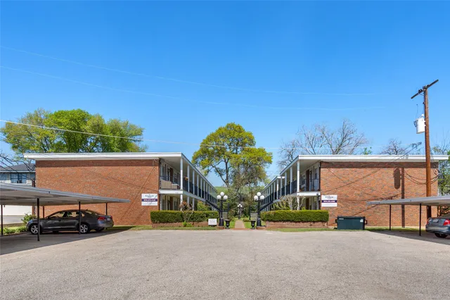 a view of a car park in front of a building