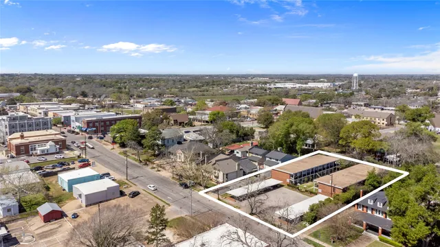 an aerial view of a house with a garden