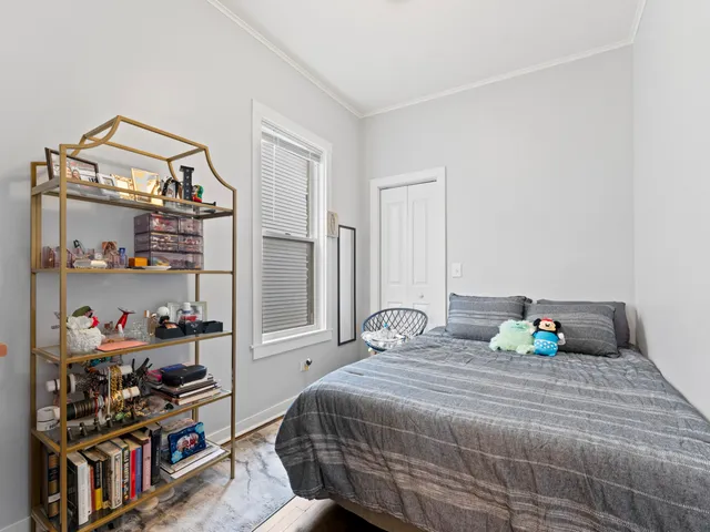 a bedroom with a bed and a closet