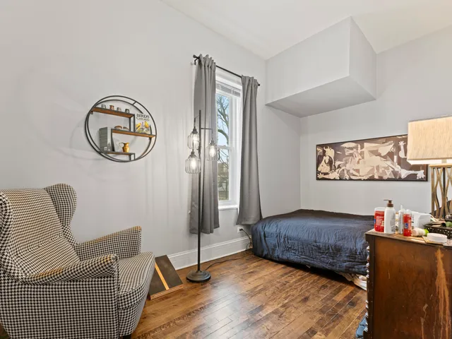 a bedroom with furniture and a window