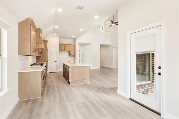 a large kitchen with a lot of counter space and appliances