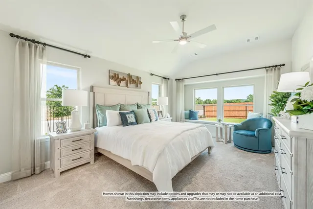 a bedroom with a large bed and windows