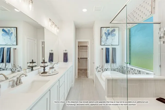 a bathroom with a double vanity sink mirror and bathtub