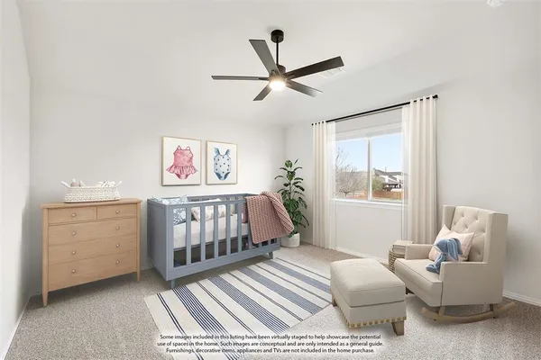 a bedroom with furniture and window