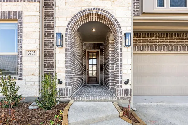 a front view of a house with a white door