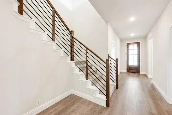 an entryway in a hall with a window