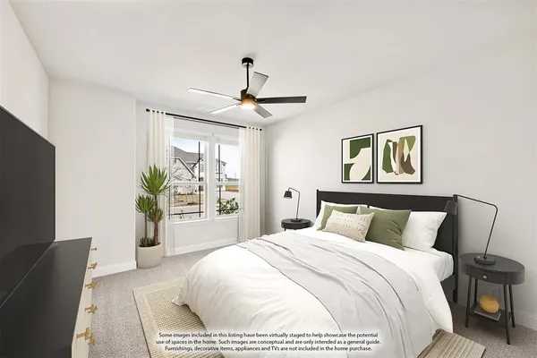 a bedroom with a large bed and a flat screen tv